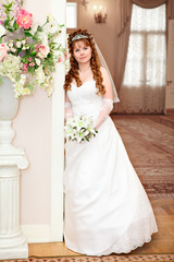 Calm beautiful bride full length portrait indoor