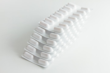 Blister stack packs of white pills