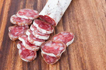 salami sausage on wooden background