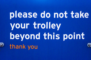 Supermaket sign for customers please do not take trolley beyond