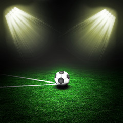 Soccer ball on the green field with lightnings