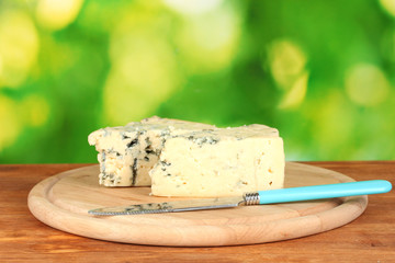 Cheese with mold and knife