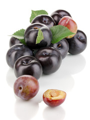 Rip plums isolated on white