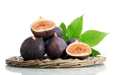Ripe sweet figs with leaves isolated on white