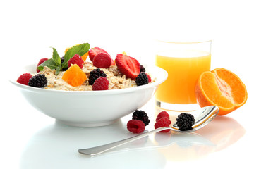 tasty oatmeal with berries and glass of juice, isolated on