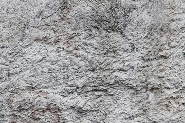 The texture of rough gray cement plaster