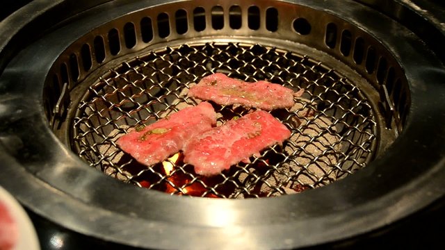 Slice sirloin on hot charcoal grill pan. Look tasty