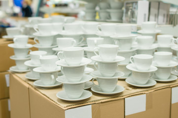 Obraz na płótnie Canvas White color tea cups in boxes in supermarket
