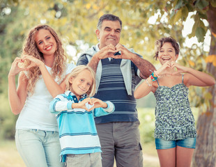 Happy Family with Heart Shaped Hands