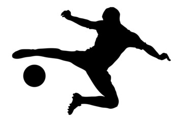 A silhouette of a soccer player shooting a ball