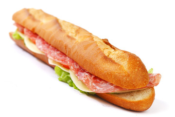 Long sandwich with  salami tomatoes isolated on white