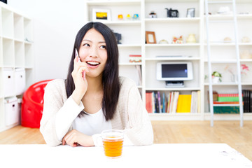 a young asian woman relaxing in the room