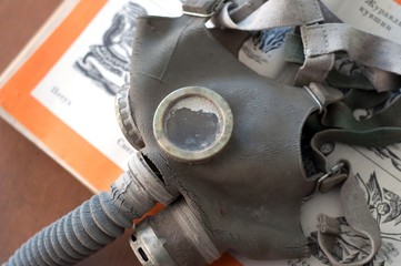 Gasmask on a book
