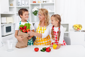 Healthy nutrition concept with people in the kitchen