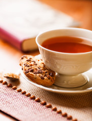 Cup of tea and chocolate chip cookie