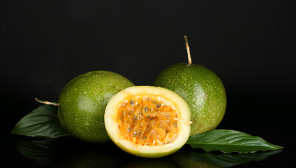 Fototapeta na wymiar green passion fruit isolated on black