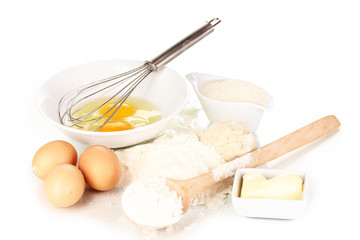 Eggs, flour and butter isolated on white