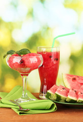 Refreshing desserts of watermelon on green background close-up