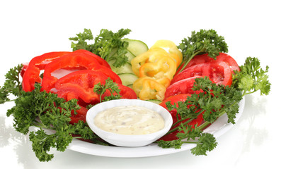 Chopped vegetables and sauce on plate isolated on white