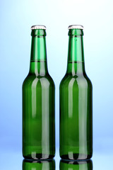 bottles of beer on blue background