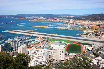 Gibraltar City and Airport Runway - obrazy, fototapety, plakaty