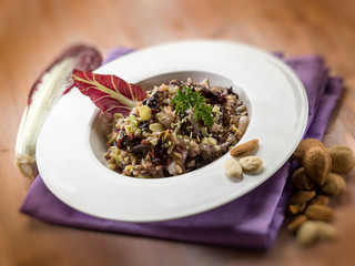 risotto with chicory and almond, selective focus
