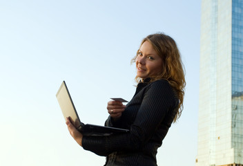 Fototapeta premium Woman doing shopping in a internet on laptop