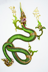 Thai style green dragon on white wall