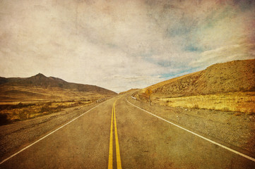 grunge image of highway and blue sky