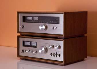 Fototapeta na wymiar Vintage hi-fi Stereo Amplifier and tuner in wooden cabinets