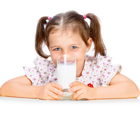 Beautiful girl drinking milk
