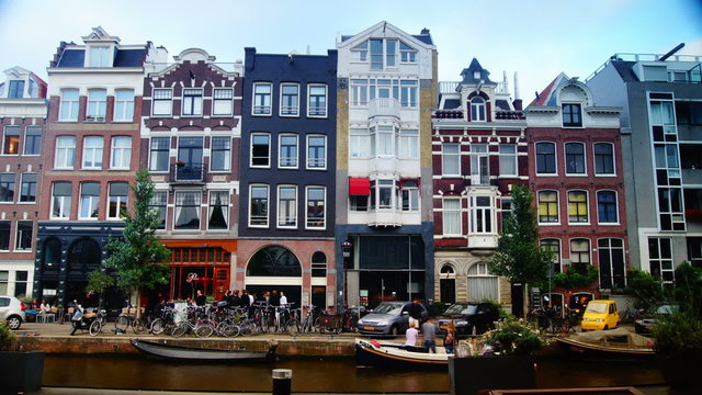 Streets, canals, bridges, buildings, boats in Amsterdam, Holland