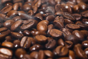 Roasted coffee beans with smoke
