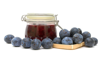 plums and plum jam on a white background