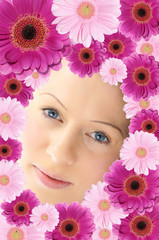 A woman's face framed by flowers