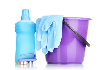 Detergent and bucket with gloves isolated on white