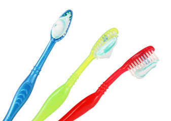 Toothbrushes in glass isolated on white