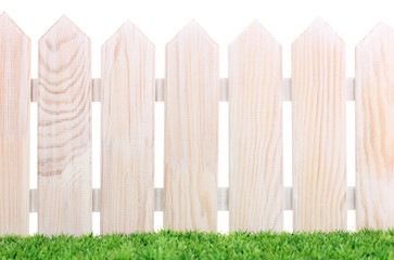 wooden fence and green grass isolated on white.