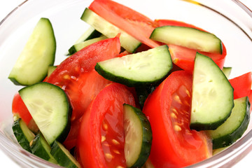 Fresh salad with tomatoes and cucumbers close-up