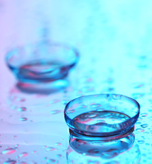 contact lenses, on pink-blue background