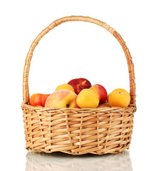 Ripe fruit in basket isolated on white