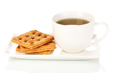 Cup of tea and cookies isolated on white