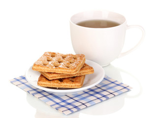 Cup of tea and cookies isolated on white