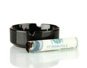 Cigar of the 100 dollar bill and an ashtray isolated on white