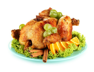 whole roasted chicken with lettuce, grapes, oranges and spices