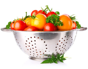 colour tomatos in colander with parsley