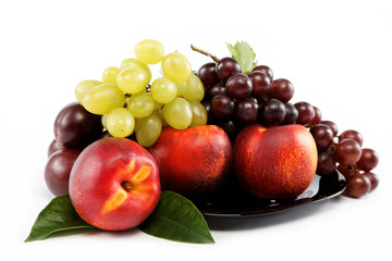 Naklejka na ściany i meble Fruits nectarine and a bunch of grapes isolated against white ba