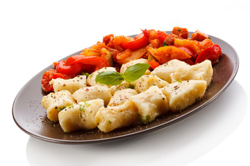 Dumplings and vegetable salad on white background
