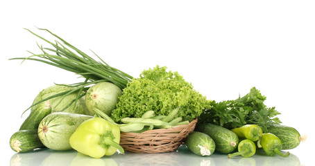 fresh green vegetables in basket isolated on white
