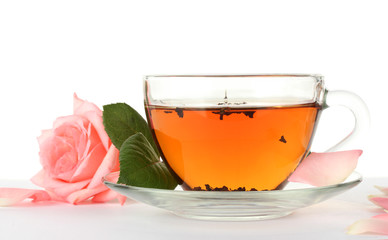 cup of tea with rose isolated on white